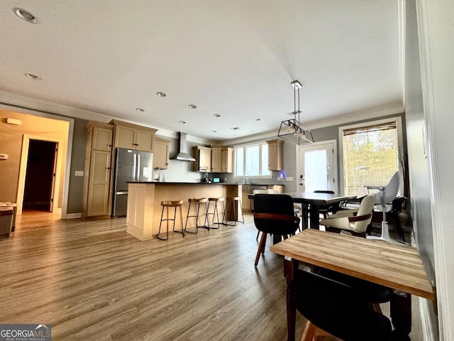 dining area with hardwood / wood-style floors and sink