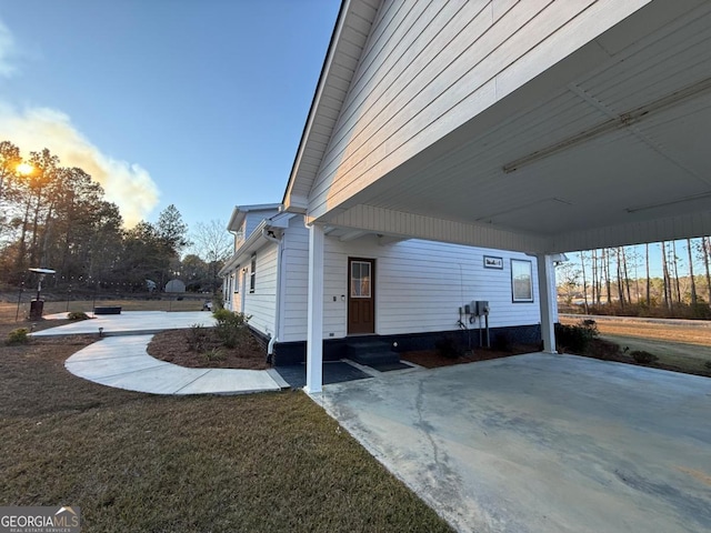 view of home's exterior featuring a carport