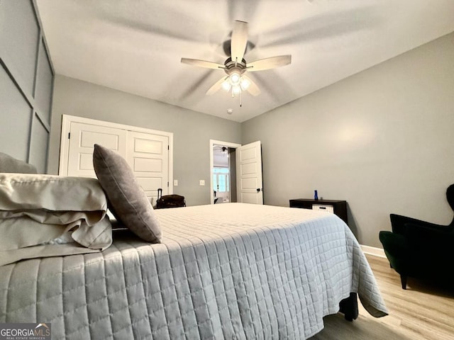 bedroom with ceiling fan and light wood-type flooring