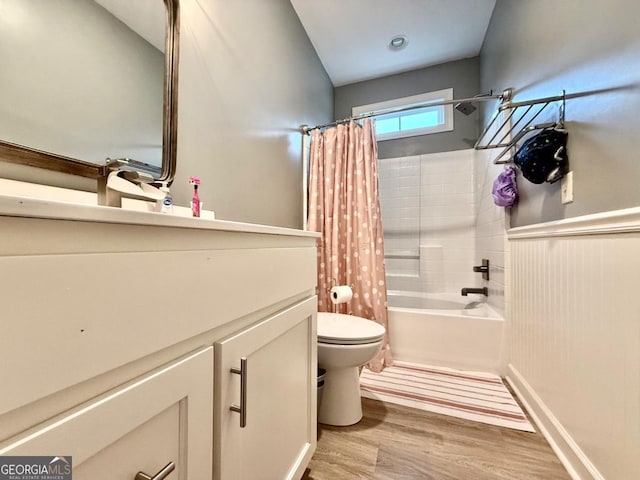 bathroom with shower / bath combo, toilet, and wood-type flooring