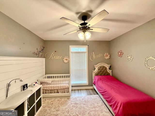 bedroom with hardwood / wood-style flooring and ceiling fan