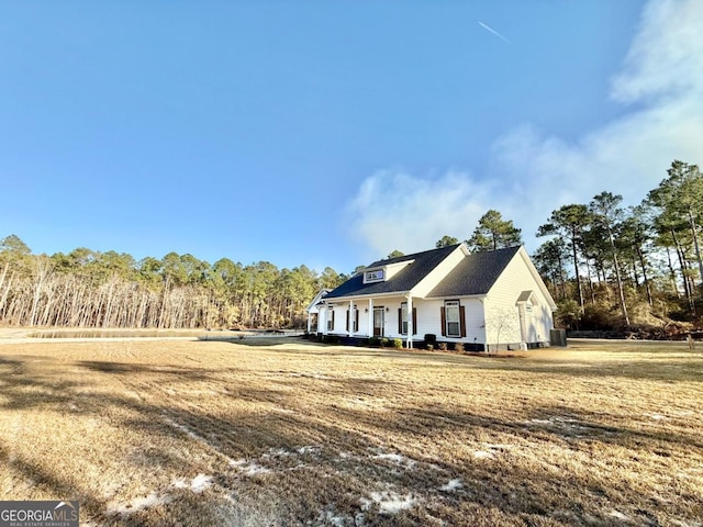 exterior space with a lawn and a porch