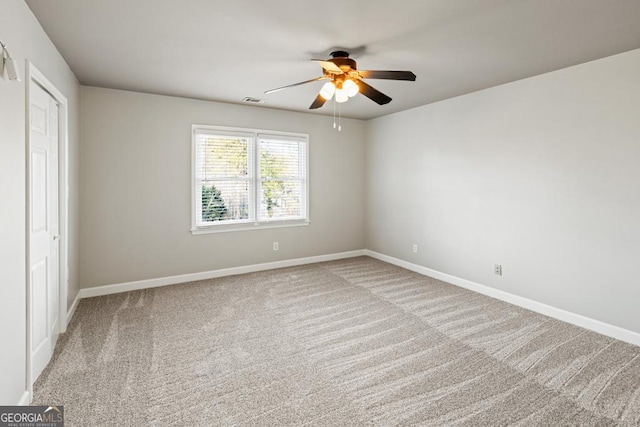 unfurnished bedroom with carpet floors and ceiling fan