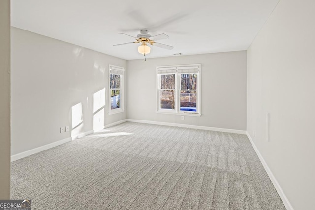 unfurnished room with carpet floors and ceiling fan