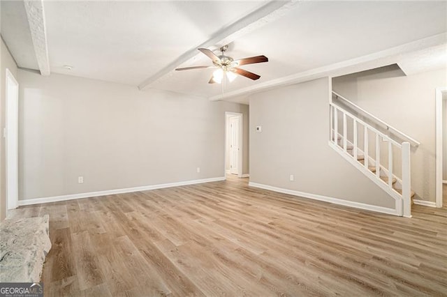 unfurnished living room with hardwood / wood-style floors and ceiling fan