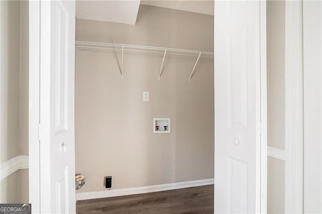 washroom featuring washer hookup and dark hardwood / wood-style floors