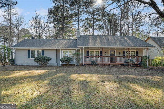 ranch-style home featuring a front lawn