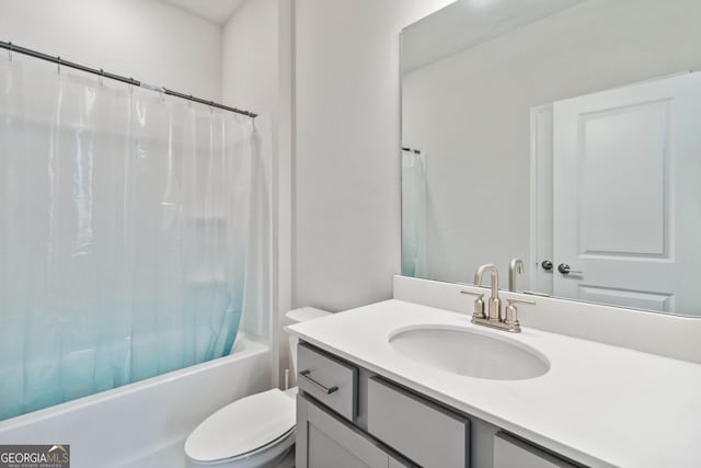 full bathroom featuring shower / bath combination with curtain, vanity, and toilet