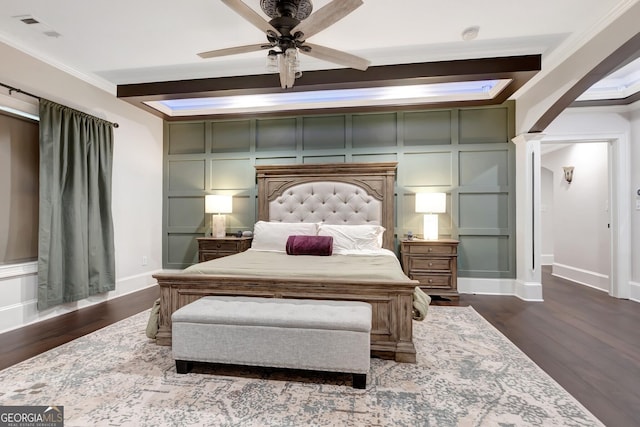 bedroom featuring ceiling fan, dark hardwood / wood-style floors, and ornamental molding