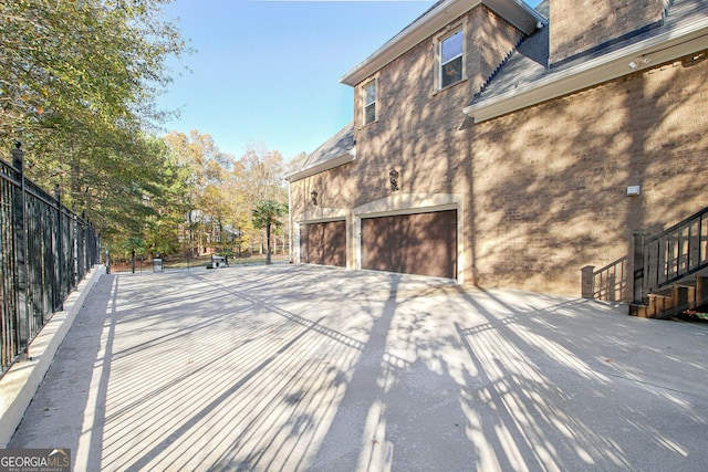 view of side of home with a garage