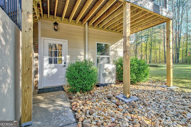 view of exterior entry featuring ac unit