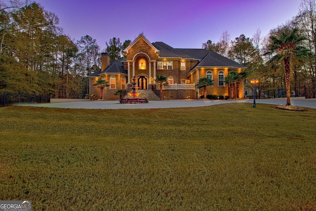 view of front of house with a lawn