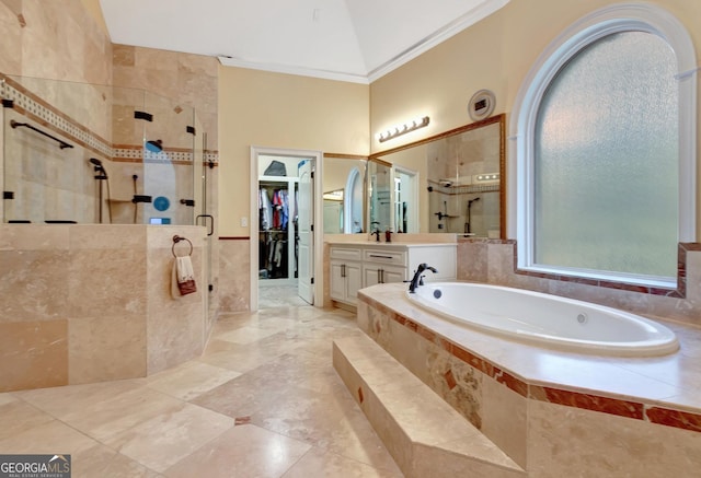 bathroom featuring lofted ceiling, independent shower and bath, crown molding, and vanity