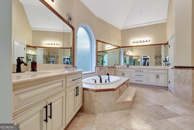 bathroom with a relaxing tiled tub, vanity, crown molding, and vaulted ceiling