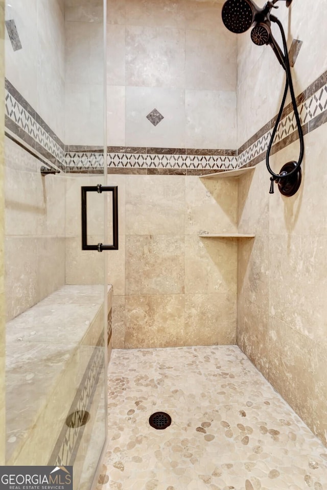 bathroom featuring an enclosed shower