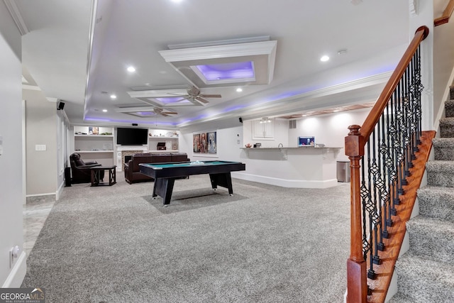 game room with pool table, light carpet, bar, ornamental molding, and ceiling fan