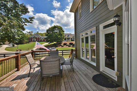 wooden deck with a lawn