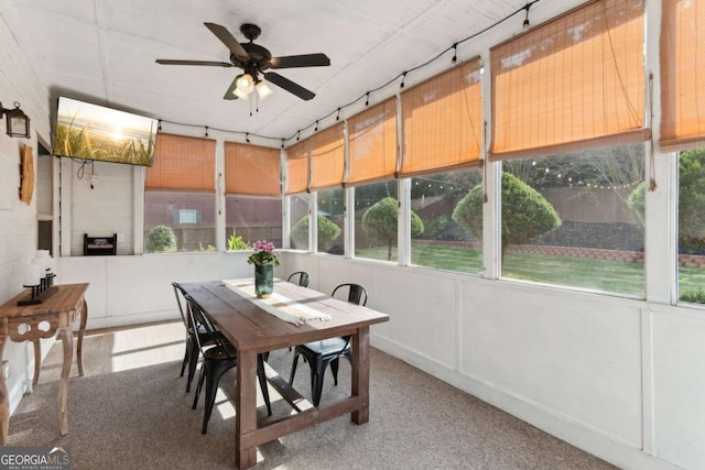 sunroom featuring ceiling fan