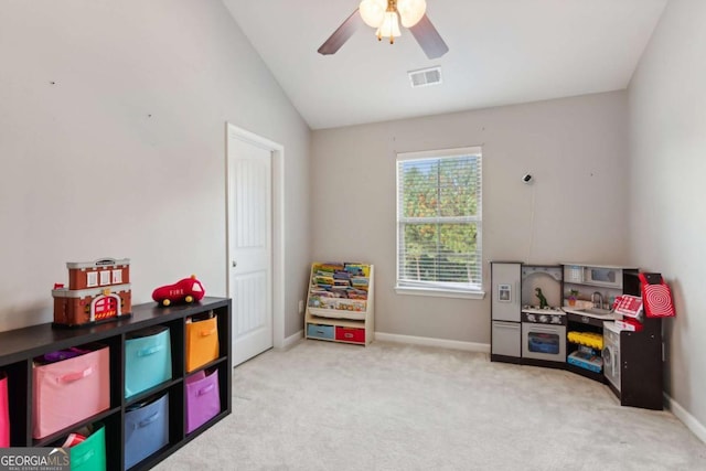 game room featuring ceiling fan, light carpet, and vaulted ceiling