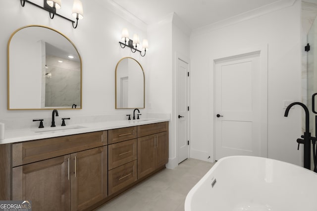 full bathroom with ornamental molding, a stall shower, a freestanding tub, and a sink