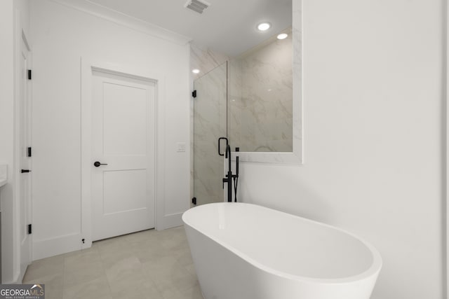 bathroom featuring recessed lighting, a soaking tub, visible vents, and a marble finish shower