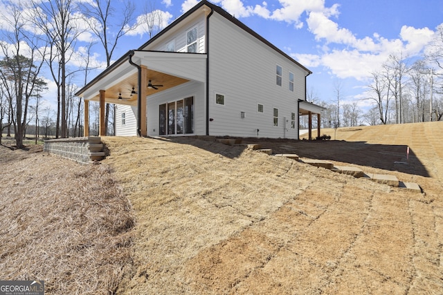 exterior space featuring ceiling fan