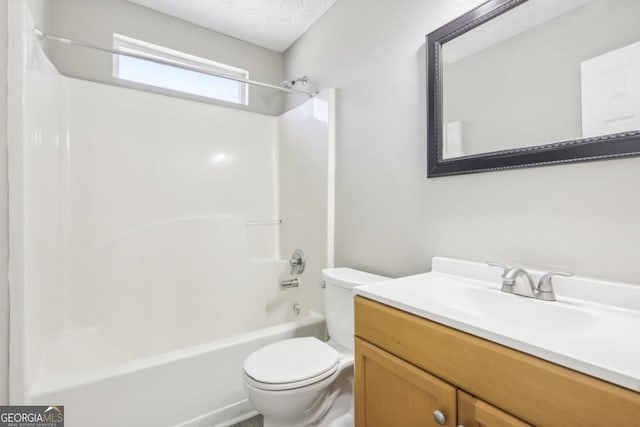 full bathroom featuring shower / bathing tub combination, vanity, and toilet