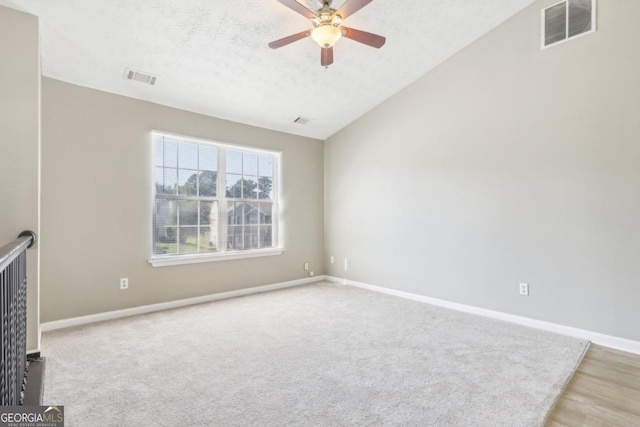 spare room with ceiling fan and a textured ceiling