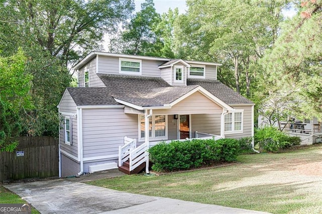 view of front facade with covered porch and a front yard