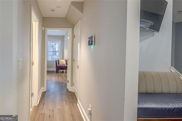 corridor featuring light hardwood / wood-style flooring