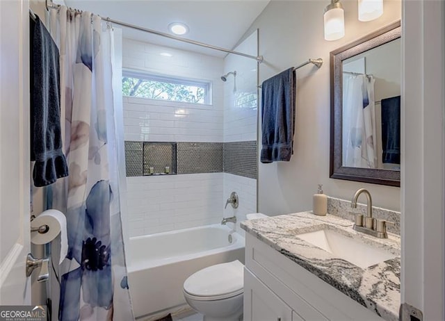 full bathroom with shower / tub combo, vanity, and toilet