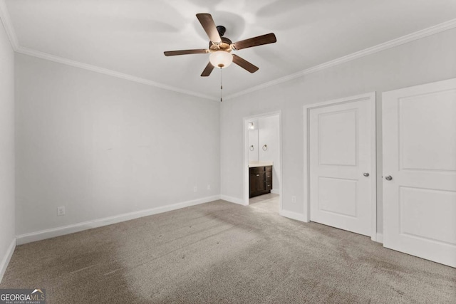 unfurnished bedroom with ceiling fan, ornamental molding, light carpet, and connected bathroom