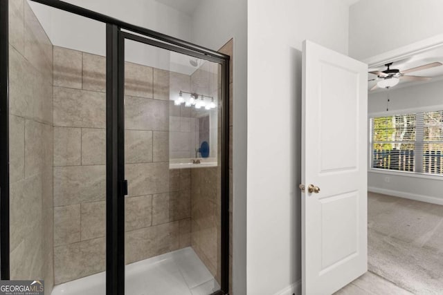 bathroom with ceiling fan and walk in shower