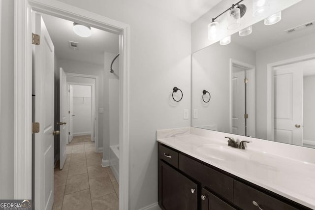 bathroom with tile patterned flooring, shower / tub combination, and vanity