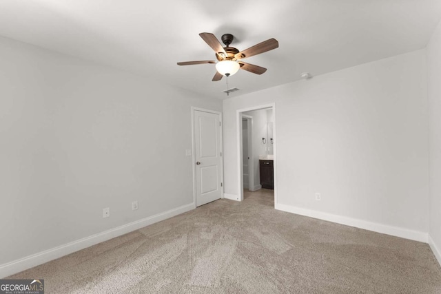 carpeted empty room with ceiling fan