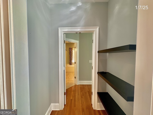 hall with light hardwood / wood-style floors