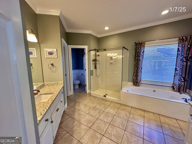 full bathroom featuring tile patterned flooring, crown molding, shower with separate bathtub, toilet, and vanity