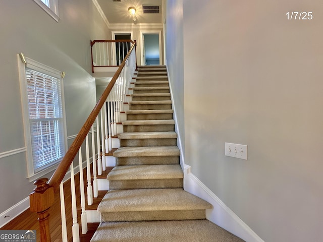 stairs featuring ornamental molding