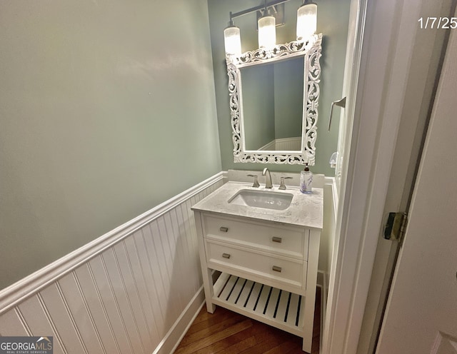 bathroom featuring hardwood / wood-style flooring and vanity