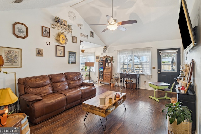 living room featuring dark hardwood / wood-style flooring, vaulted ceiling, and ceiling fan