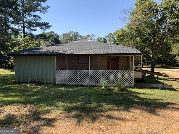 view of side of property with a yard