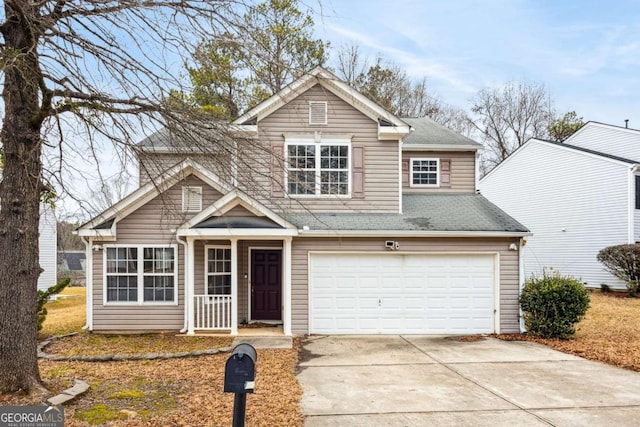 traditional home with concrete driveway, roof with shingles, and an attached garage