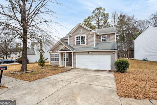 view of front of property with a front lawn and a garage