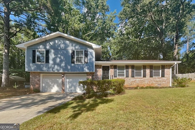 split level home with a front yard and a garage