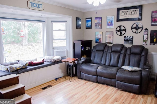 living room with ceiling fan, light hardwood / wood-style floors, ornamental molding, and cooling unit