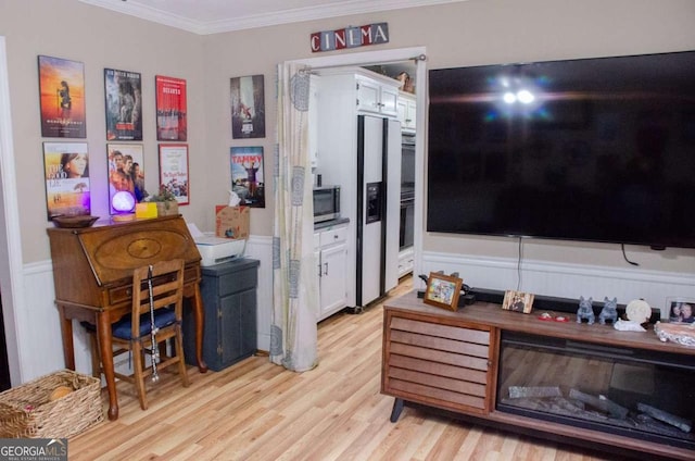 kitchen featuring white cabinets, oven, white fridge with ice dispenser, ornamental molding, and light hardwood / wood-style floors