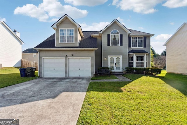 view of front of house with a garage, a front yard, and french doors