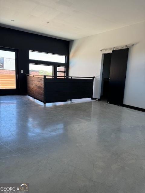 spare room featuring concrete flooring