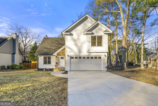 view of front property featuring a front yard and a garage