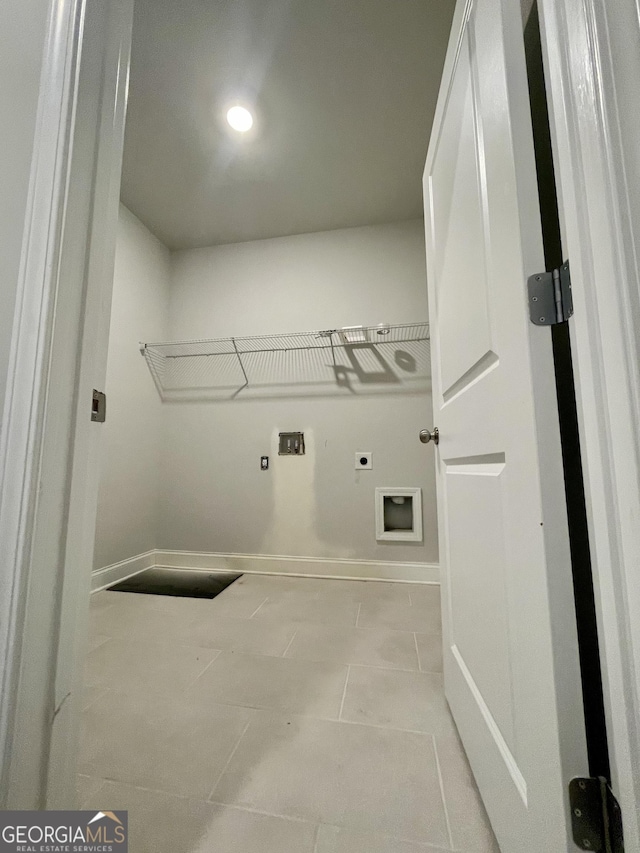 washroom with light tile patterned flooring, electric dryer hookup, and washer hookup